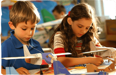 Children building a model together